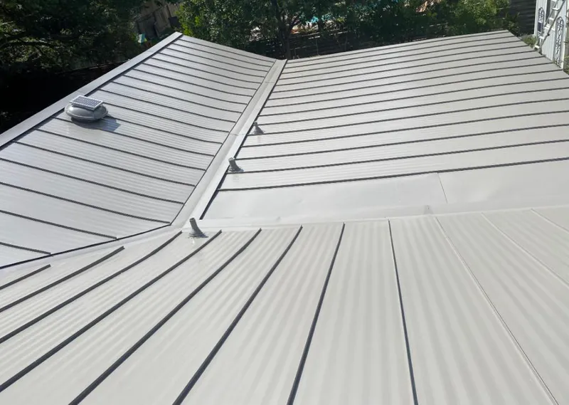 Solar attic fan installed on a metal roof for Roof Ventilation in North Auburn